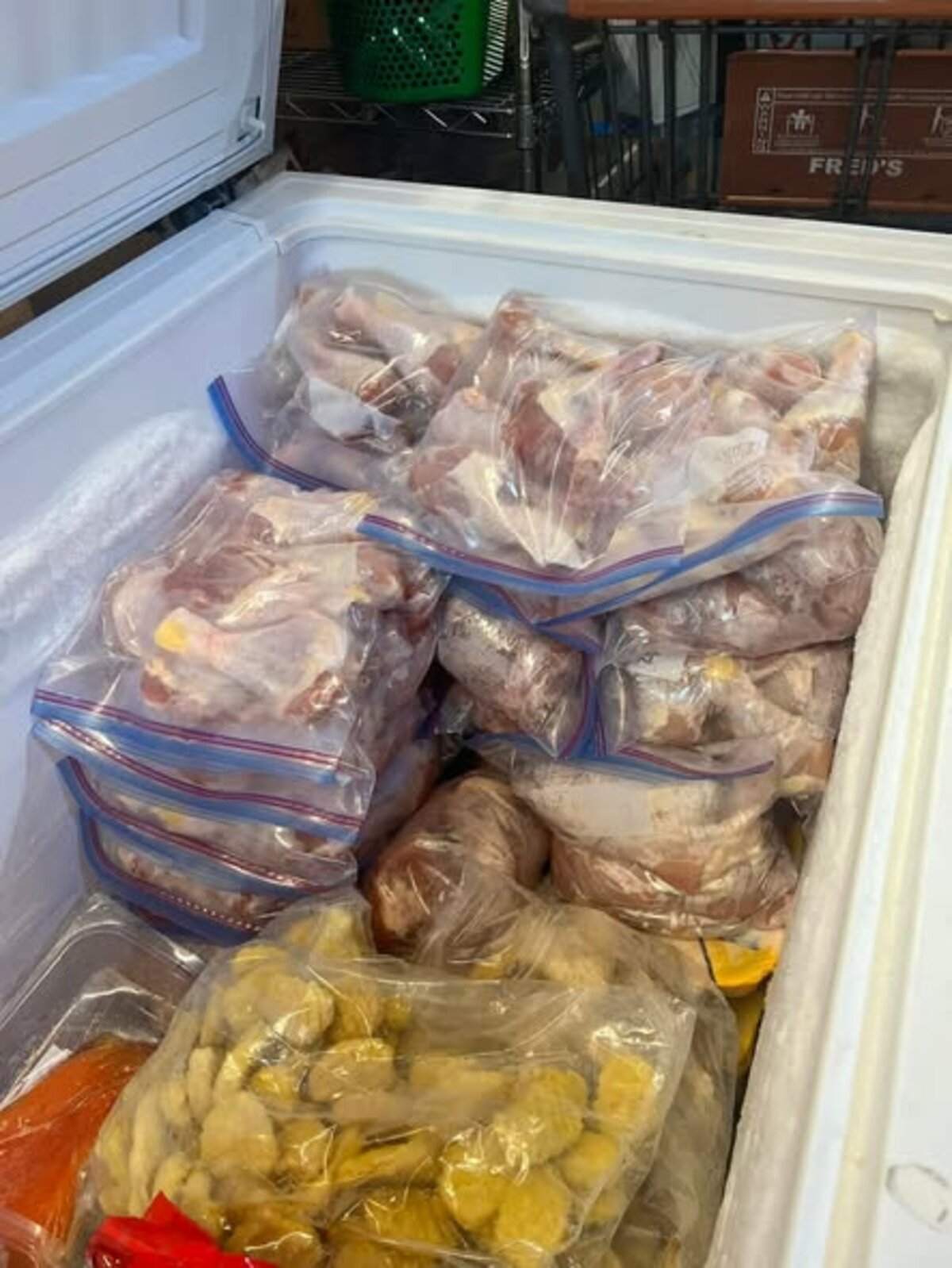 Pam Otts’ freezer overflowing with frozen meals and ingredients prepared for Widows Oil Ministry blessing bags